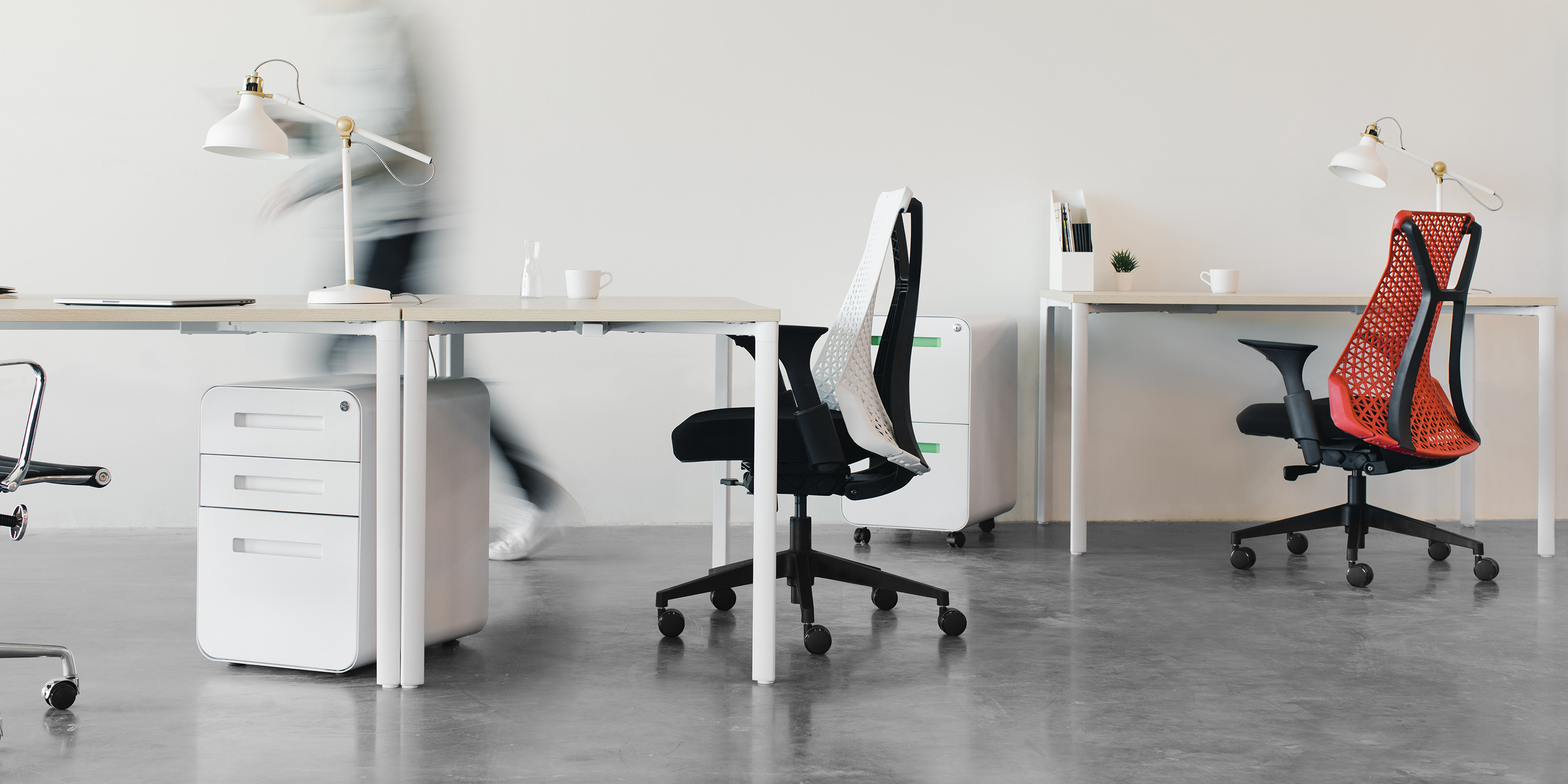 Minimal office with two swivel chairs and simple desks